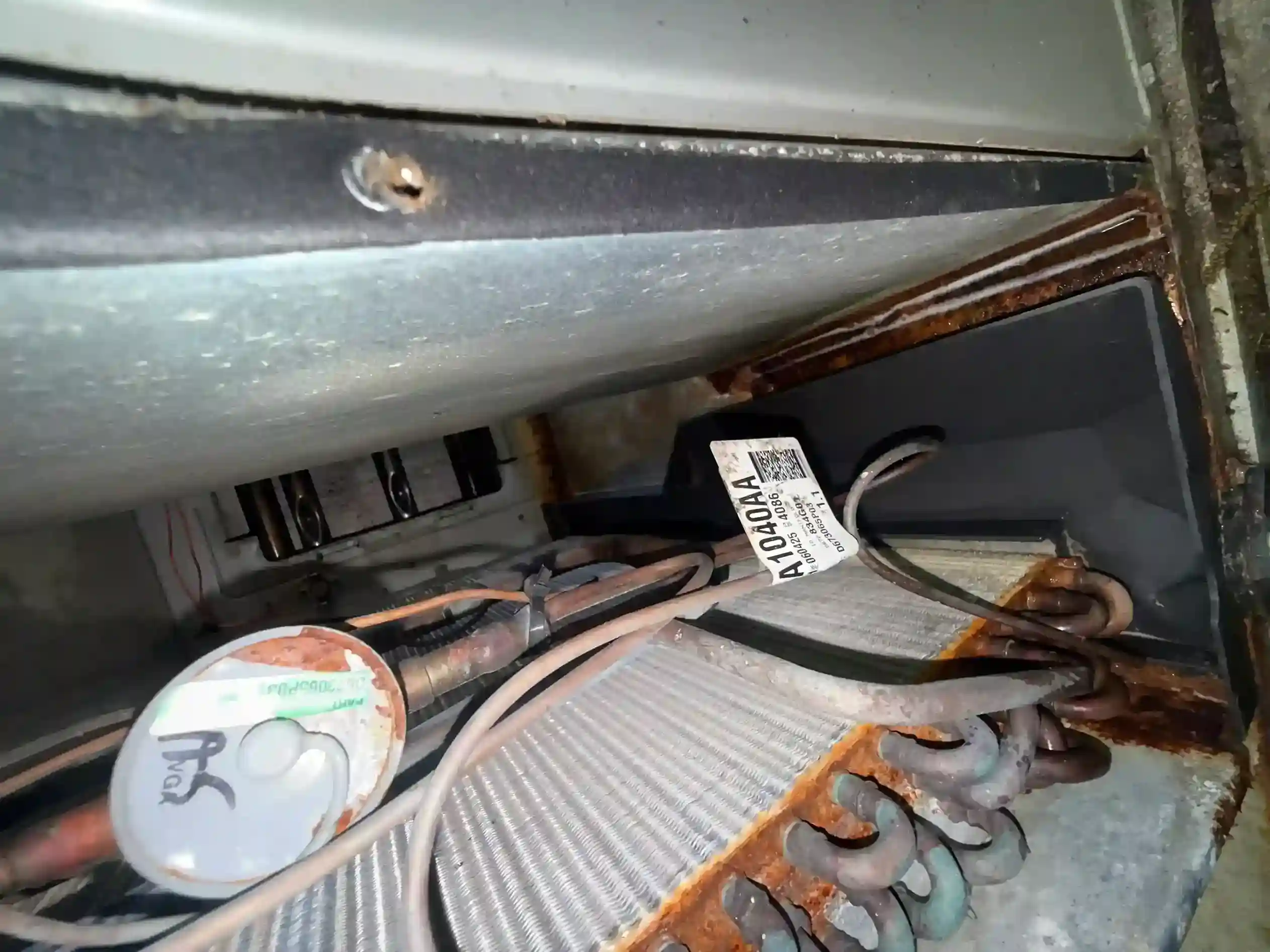 Evaporator coil part A1040AA showing extreme rust corrosion with TXV and copper refrigerant tubing