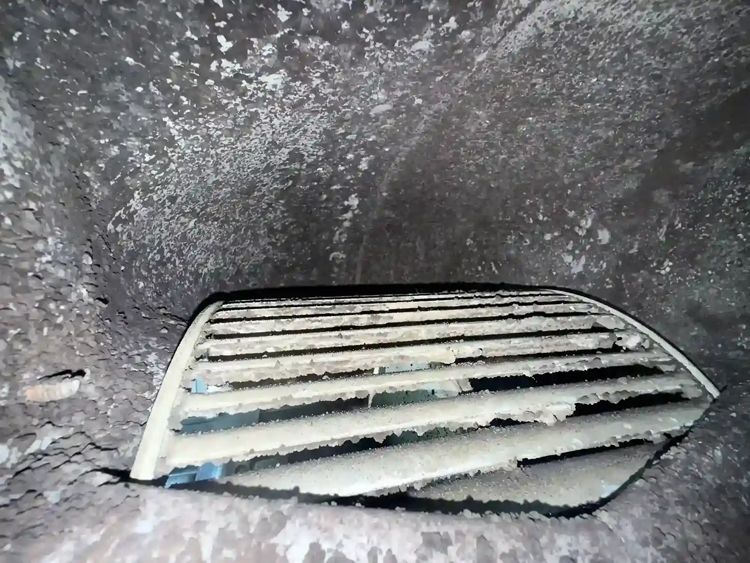 Thick dust and debris coating on interior duct trunk line walls