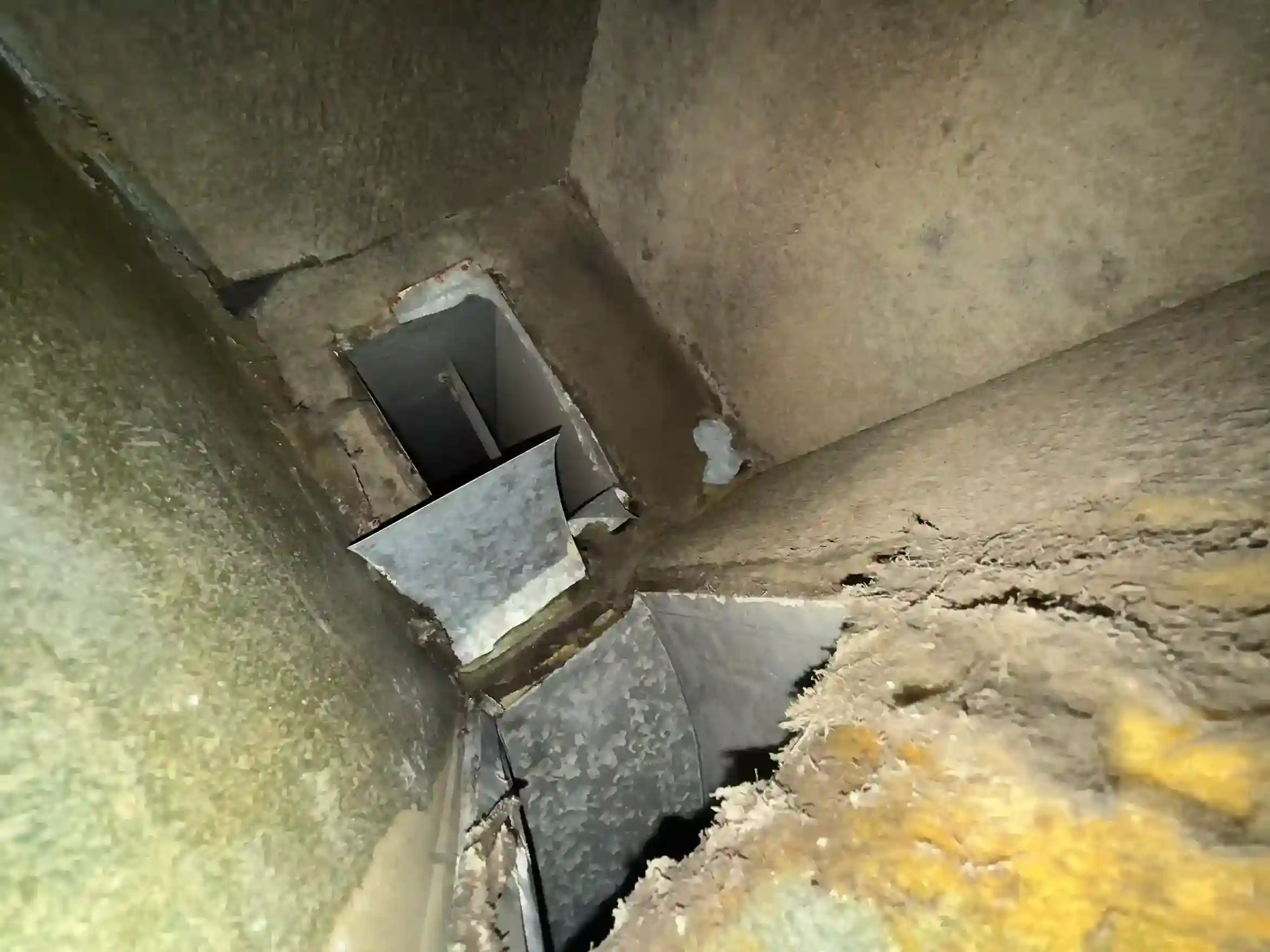 Soiled HVAC component interior with dust and debris documented prior to deep cleaning